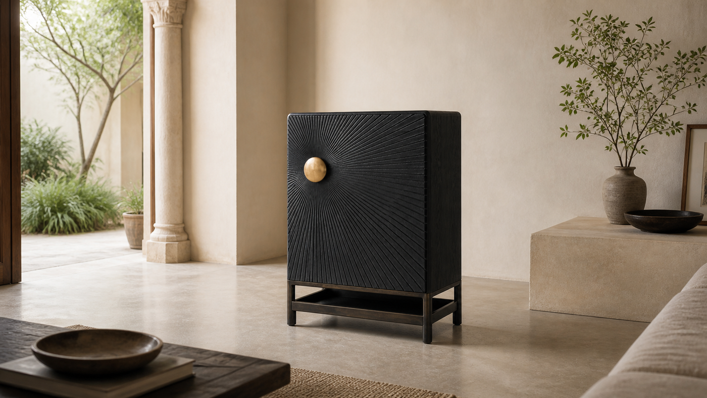 AUTHË v2 panoramic header — Halo Cabinet in a light contemporary interior, showing one hand-carved radial door, one offset bronze boss and one open lower shelf