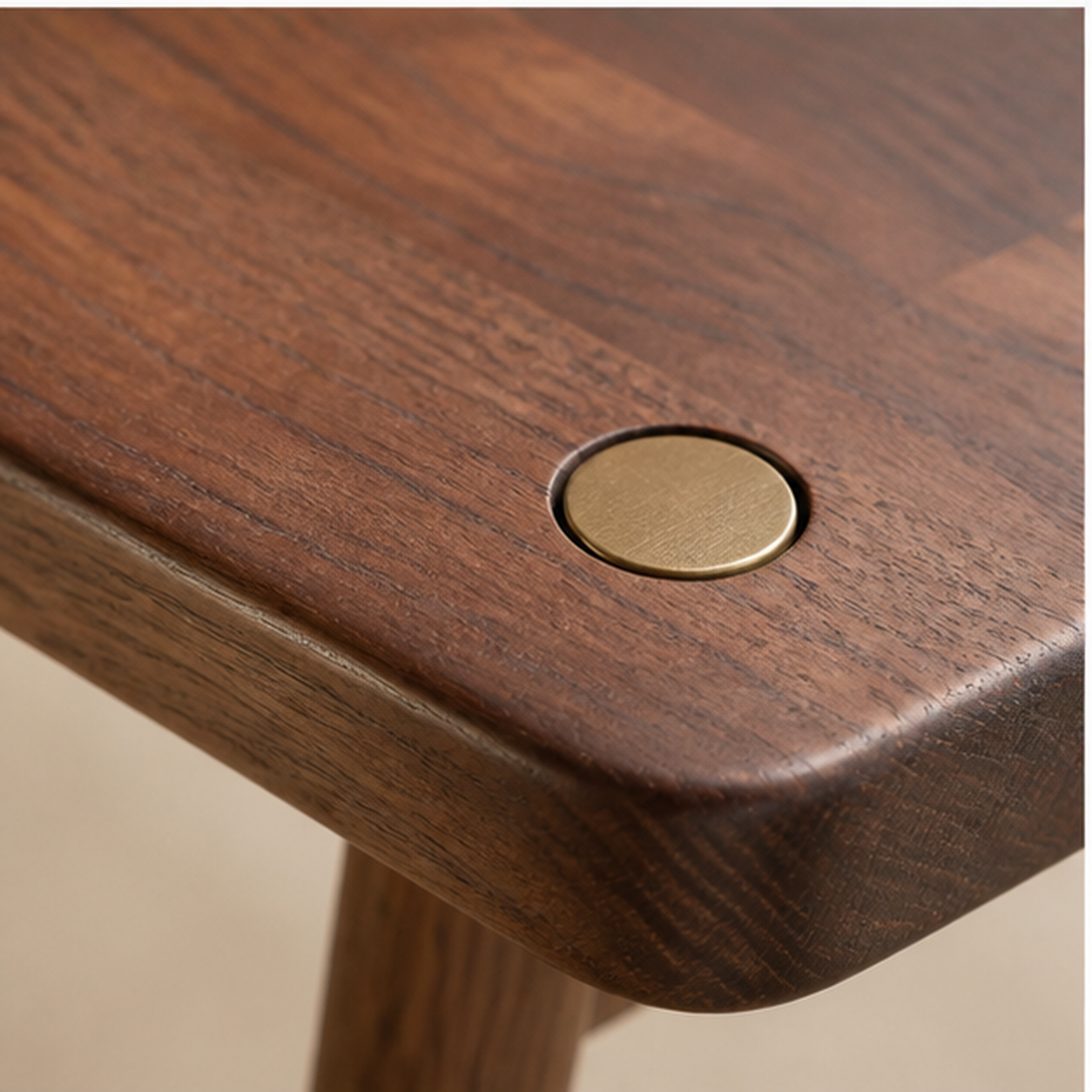 Pin Bench close detail of cast-bronze pin and hand-finished walnut grain